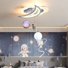 the bedroom is decorated with space themed wallpapers and lights, along with an astronaut mural