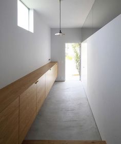 an instagram photo of a hallway with white walls