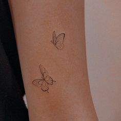 two small butterflies on the wrist