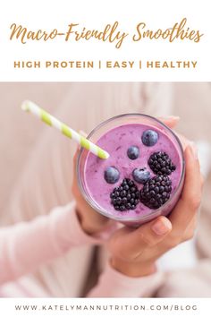 a person holding a glass filled with blueberries and raspberry smoothie, text reads macro - friendly smoothies high protein easy healthy