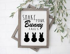 a sign that says shake your bunny tails on it next to a branch with leaves