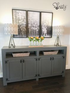 an entertainment center with two baskets on top