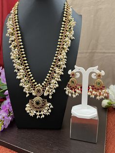 Guttapusalu Haram Rice Pearls Long Haram/Ruby Kemp Traditional Trendy Haram 29.0 inches/Antique Gold Finish/Bridal haram/Matching Earrings This item is perfect for parties and festivals Gift ! DETAILS: Includes One  Long Haram and Two Earrings. Necklace: 25.4 inches.29 inches total Long  Adjustable length. Chain closure. Weighs 3.75oz (108.g).  Earrings: 2.0 inch(es) long. Earring set weighs 0.50 oz ( 15g). Earring backs push on/off. Material: Imitation Antique Gold Finish  pearls, Kemp Ruby Eme Gold Guttapusalu Haram, Pearls Long Haram, Guttapusalu Haram, Long Haram, Rice Pearls, Long Earring, Gold Jewellery Design, Jewellery Design, Gold Jewellery