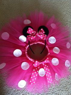 a pink minnie mouse tutu with polka dots