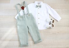 Boys pants with pockets and suspenders made from linen fabric. Adjustable rubber inside.Comes with removable straps, the pants have a large reserve for buttons. *Listing includes: - pants with suspenders - matching bow tie (you can choose another color) closure with CLIP - white cotton mandarin collar shirt + WARNING- Color may different on your screen and in real life, do to different settings and devices ** + Please be understandable, each work is individually created and can vary by a few mm- Toddler Boy Wedding Outfit, Green Tux, Mr And Mrs Jones, Pants With Suspenders, Baby Suspenders, Mandarin Collar Shirt, Suspender Pants, Green Suit, Dream Wedding Ideas Dresses