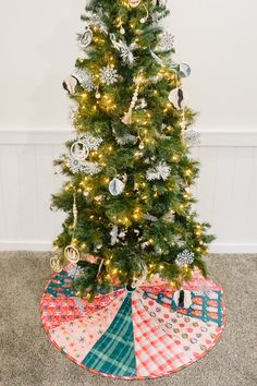 a small christmas tree with ornaments on it