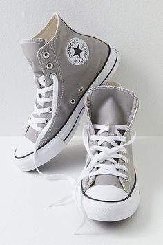 **Fit:** This style is in unisex sizing so a men's size 4 is a women’s size 6. Classic canvas high top Chuck Taylors. | Chuck Taylor All Star Hi Top Converse Sneakers at Free People in Grey, Size: US 5 M Cute Shoes Sneakers Converse, Cute Converse Shoes High Tops, Shoes For Back To School 2024, Dresses With Converse High Tops, Cute Shoes Converse, Grey Converse Outfit, Shoes For Moms, Shoes For Back To School, Converse Colors