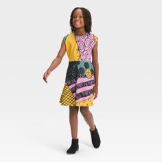 The Nightmare Before Christmas Sally Dress is perfect for wearing during the Halloween season. Your child will love flaunting their fandom for the classic movie with this printed pullover dress that is designed like Sally's iconic patchwork dress in yellow, pink, teal blue and black. Made of a stretchy, lightweight scuba fabric, the knee-length dress features a scoop neckline and sleeveless design. Pink Short Sleeve Halloween Dress, Pink Short Sleeve Dress For Halloween, Playful Multicolor Graphic Print Dress, Nightmare Before Christmas Girl, The Nightmare Before Christmas Sally, Sally Dress, Nightmare Before Christmas Sally, Scuba Fabric, Disney Dresses