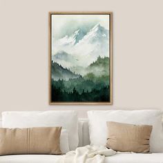 a painting hanging on the wall above a couch in a living room with white furniture