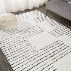 a white rug with black lines on it