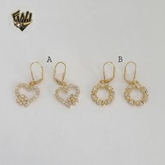 Description: -Zircon Dangling Earrrings. -Material: 18k Gold Filled (BGF). -Size: Width x Length. -A: 17.5mm x 16mm. -B: 17mm. Select the Desired Style. Gold Dangle Heart Earrings With Cubic Zirconia, Gold Cubic Zirconia Dangle Heart Earrings, Gold Heart Earrings With Prong Setting For Wedding, Gold Cubic Zirconia Heart Dangle Earrings, Gold Heart Earrings With Diamond Accents For Wedding, Gold Diamond Round Heart Earrings, Gold Diamond Heart Earrings For Wedding, Gold Heart Earrings With Cubic Zirconia For Formal Events, Gold Heart Earrings With Cubic Zirconia For Formal Occasions