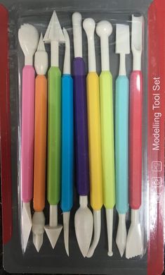 six different colored toothbrushes in a package