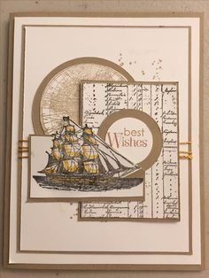 a card with a ship on it and the words best wishes written in gold ink