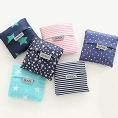 four small wallets with stars and stripes on them, all lined up in different colors