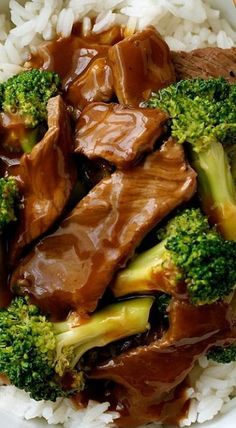 beef and broccoli with sauce on top of rice