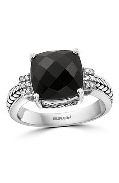 Glinting diamonds accent a sterling silver ring centered with a faceted onyx center stone. Total diamond weight: 0.06ct. Sterling silver/onyx/diamonds 
 Made in the USA Formal Black Rings With Gemstone Accents, Elegant Black Rings With Gemstone Accents, Black Rings With Gemstone Accents, Black Sterling Silver Diamond Ring With Polished Finish, Black Diamond Ring With Accent Stones For Formal Occasions, Elegant Onyx Rings With Diamond Accents, Formal Black Diamond Ring With Accent Stones, Black Onyx Rings With Diamond Accents, Elegant Sterling Silver Diamond Ring With Black Diamonds