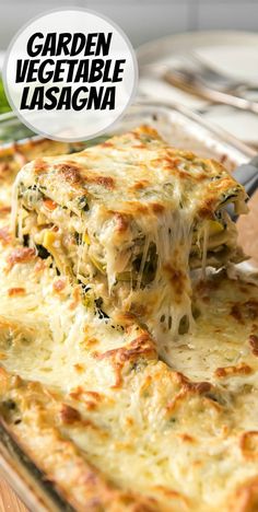 someone is taking a piece of lasagna out of the casserole dish