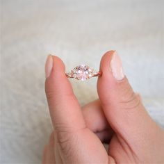 This version of Thea will make you want to pop the bubbly with her blush champagne sapphire on full-display! #rings #engagementrings #weddingrings #rosadosbox #rosegold #blush #champagne #sapphire #gemstone #diamonds #artdeco #cluster #oval #ovalengagementring #jewelry #finejewelry #gifts Luxury Morganite Diamond Wedding Ring, Exquisite Morganite Diamond Ring For Anniversary, Classic Morganite Wedding Ring With Brilliant Cut, Morganite Gemstone Jewelry For Proposal, Exquisite Morganite Rings For Anniversary, Morganite Ring For Proposal, Morganite Ring Jewelry For Proposal, Luxury Oval Morganite Wedding Ring, Classic Morganite Diamond Ring For Wedding