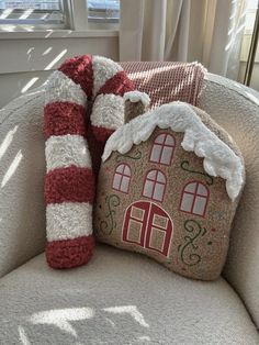 a pillow with a gingerbread house on it