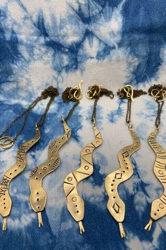 This brass snake is hand cut and hand stamped, so each one is a one of a kind.  It is a unique piece for someone who loves reptiles or just a fan of animals! This piece makes a very nice statement piece that instantly dresses up an outfit.  When you order, please specify which design you like 1, 2, 3, 4, or 5. Hood River, Snake Pendant, Reptiles, Pendant Necklaces, Hand Stamped, 1 2 3, Statement Pieces, Unique Pieces, Necklace Etsy