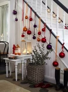 christmas decorations are hanging on the banister