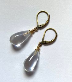 "Crystal clear glass earrings. Clear glass drops, designed by Allen Owen and made for us in Germany. \"Brights 6\" earrings measure 7/8 inches in length. Ear wires are 14k. gold filled or antiqued brass lever backs. All hand work done in the USA. Owen Glass Collection jewelry is ready for gift giving, with earrings backs, an organza bag and description card included. Please let us know if you would like us to make a matching bracelet or necklace of any length. All custom orders are welcome. ♥ Fo Glass Drop Earrings As Gift, Glass Drop Earrings For Formal Occasions, Formal Glass Drop Earrings, Minimalist Glass Drop Earrings, Minimalist Teardrop Glass Jewelry, Glass Drop Earrings With Matching Set, Modern Clear Dangle Earrings, Modern Glass Teardrop Earrings, Minimalist Glass Dangle Earrings