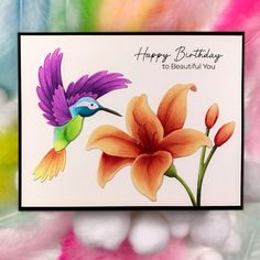 a birthday card with an image of a hummingbird and flower