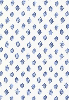 a blue and white wallpaper with leaves on it