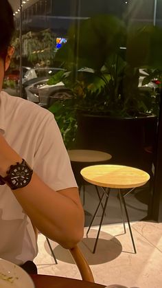 a man sitting at a table eating food