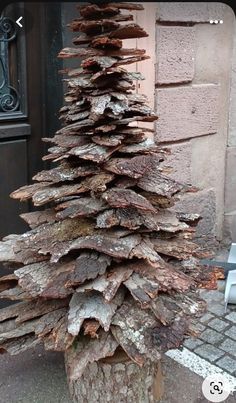 a very tall tree made out of logs