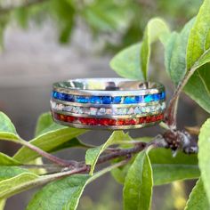 Handmade American ring inlaid with a red, white, and blue opal. This is a great ring that looks absolutely stunning and works great for anyone. This ring comes with a width of 8mm which is just enough to show off every amazing color of the American flag. This ring is perfect for anyone wanting to show their pride and support for America and its beautiful flag. All Designed By Ric rings are made to order. This gives each customer a distinctively individual ring for style and flair. Crafted meticu Thor Ring, Channel Ring, Opal Band, Meteorite Ring, Digital Devices, Titanium Ring, Jewelry For Men, Men Jewelry, Titanium Rings