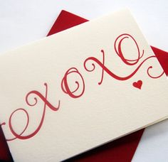 two red and white cards with the word love written on them in cursive writing