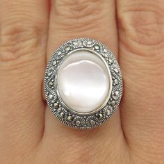 Great vintage condition.  925 Sterling Silver Vintage Real Mother-of-Pearl Marcasite Gemstone Ring Size 8  Weight: 9.1g   WELCOME TO PAWN SHOP We are an actual pawn shop and have been in business for over 25 years. Since 1990, our establishment has been serving a variety of clients by providing them with short term cash solutions and options of liquidity regarding their treasured heirlooms. Acknowledging that today′s customers are very sophisticated and are looking for a variety of investments, Mother Of Pearl, Halloween Shopping, Vintage Jewelry, Gemstone Rings, Ring Size, Jewelry Rings, 925 Sterling Silver, Accessory Gift, Sterling Silver