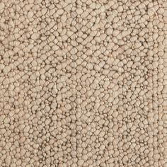 the texture of an upholstered carpet is shown in light beiges and browns