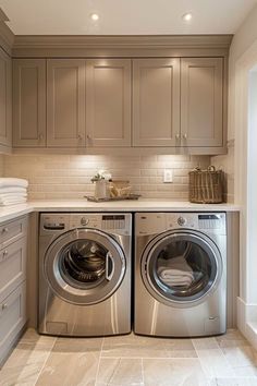 a washer and dryer sitting in a kitchen next to each other on top of a counter