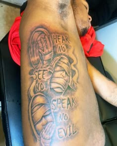 a man with a tattoo on his arm that says, hear no speak no evil