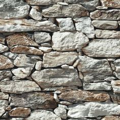 a stone wall that is made out of rocks