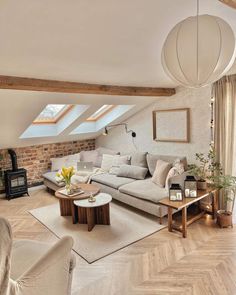 a living room filled with furniture and a skylight