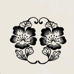 a black and white drawing of two flowers on a white background, with the letter e in the middle