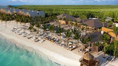 an aerial view of a resort on the beach