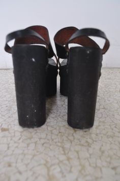 Great shoes from the 70s, all made of wood and leather straps. There are hardly no damages, rubber attached to the bottom. Please see measures inquire with questions you may have. Measures, heel height 5 1/2 inch, from heel to toe bottom8 1/2 inch, inside 9 inch. Get 15% discount w code crazyfashion, free domestic shipping. 1970s Shoes, Cruella Costume, Metallic Purse, Leather High Heels, The 70s, Platform Shoes, Made Of Wood, Headpiece, High Heel