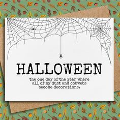 a card with the words halloween on it and a spider web hanging from it's net