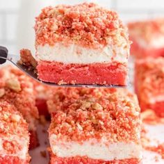 several pieces of red velvet cake on a white plate with a fork in the middle