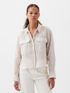 Soft, breathable linen cropped shirt.  Point collar.  Long sleeves with button cuffs.  Button front.  * Fit: Slightly fitted.  Sits close to the body.  Cropped, hits at the waist.  Note: Tyla is wearing a Gap Striped Linen Shirt, White Linen Shirt, Women Shirt Top, Linen Crops, Cropped Shirt, Striped Linen, Crop Shirt, Petite Size, White Linen