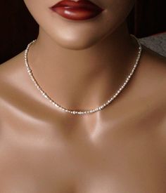 The necklace is made of 2.5 - 3 mm. real  freshwater pearl beads. Very small and delicate jewelry. A length is 15.5'' ( 38.75 cm. ) and 3'' ( 7.5 cm. ) extender. The necklace will be packaged in a gift box. Your necklace is ready to ship. Thank you for visiting my shop. Pearl Necklace Freshwater, Dainty Choker, Real Jewelry, Necklace Pearl, June Birthstone, Delicate Jewelry, Minimalist Necklace, June Birth Stone, Pearl Beads