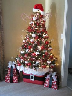 a decorated christmas tree with presents under it