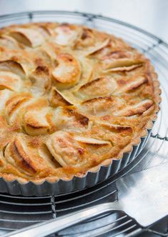 a pie sitting on top of a metal rack