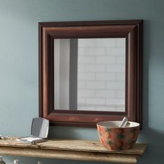 a bathroom with a sink and mirror on the wall