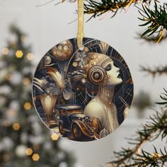 an ornament hanging from a christmas tree decorated with art nouveau artwork and lights