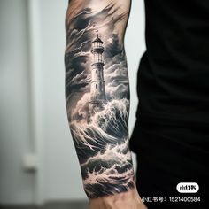 a man's arm with a lighthouse in the middle of it and storm clouds